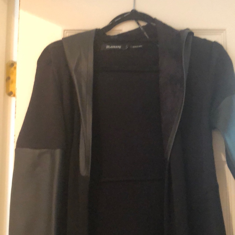 Knee length black cardigan with faux leather